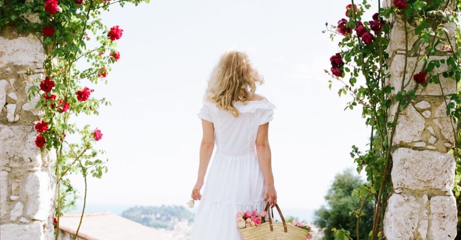 Pergola - Back View of a Woman in a White Dress Holding a Basket Standing under a Pergola with Roses